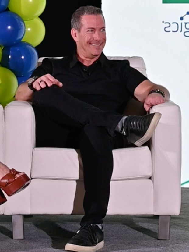 Gregg Garfield, CEO and founder of Chip In payment processing company, sitting in a chair at a charity event